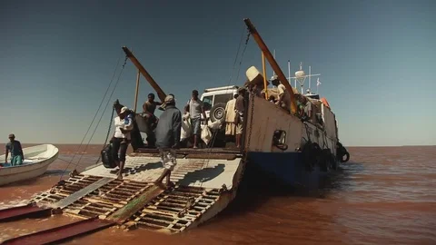 People unloading a boat Stock Footage 73660501