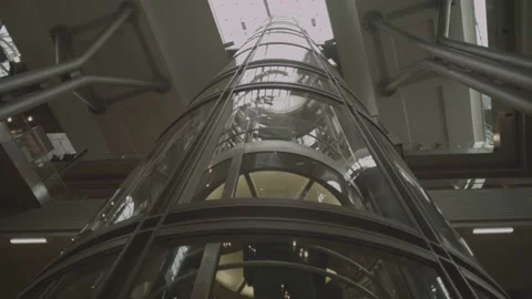 People use elevator to move up to higher levels of train station Stock Footage 195223345