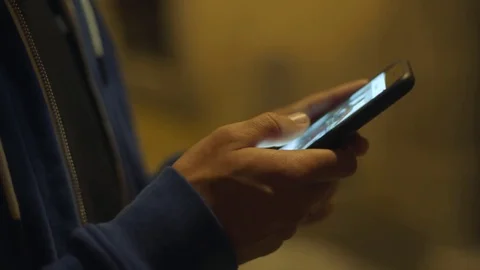 People use phone on night street Stock Footage