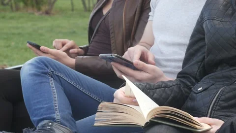 People use smartphones and read a book 動画素材 90182753