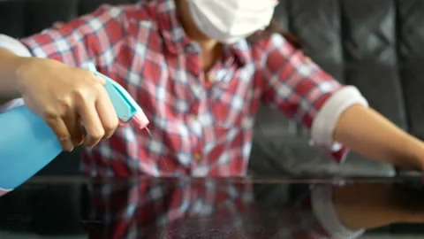 People use spray bottle with sterilizing solution make cleaning and disinfection Stock Footage 131806549