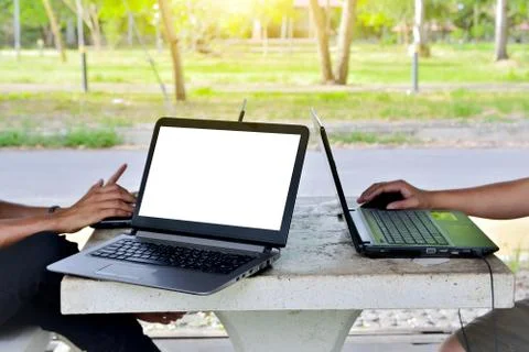 People using computer notebook by mobile internet online for work Stock Photos