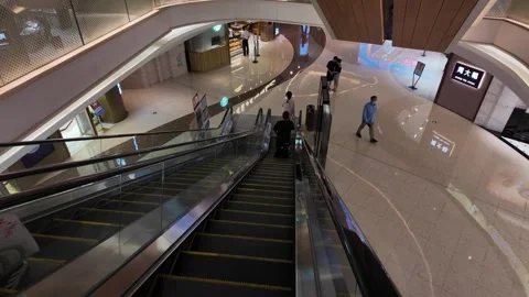 People Using Downward Escalator in Modern Chinese Shopping Mall Interior Stock Footage 336170220