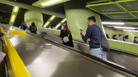 People using elevator in the MTR subway tunnel, Hong Kong, which is Stock Footage 157535981