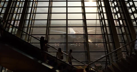 People using escalator to boarding gate, high contrast shot in airport Stock Footage 297055801