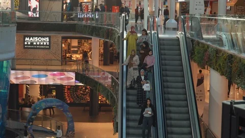 People using escalator in Morocco Mall Stock Footage 125375638