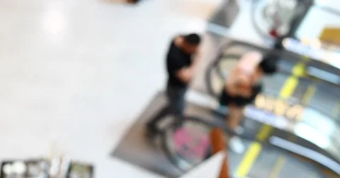 People using escalator in shopping mall centre, blur scene Stock Footage 83355027