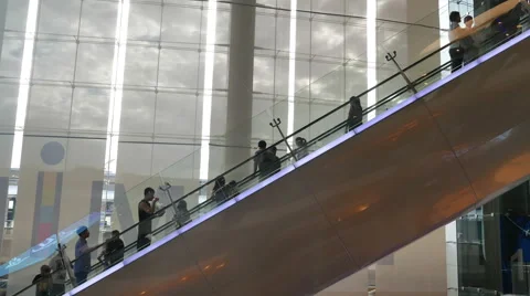 People using the escalator in Terminal 21 Shopping Mall Bangkok. Stock Footage 62853857