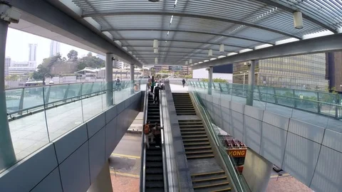 People using escalator at Tsim Sha Tsui Promenade (time-lapse) Stock Footage 75716826