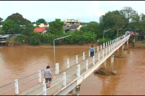 People Using A Footbridge To Cross Over River In Thailand Stock-Footage 516357
