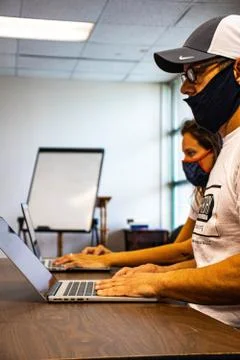 People using Laptops during Covid AJPhotography.VA Stock Photos