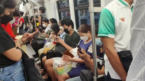 People using mobile phone in public underground train Stock Footage 262602927