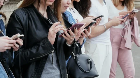 People using the mobile phone, surf the Internet, play the game and use the app Stock Footage 107678146