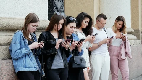People using the mobile phone, surf the Internet, play the game and use the app Stock Footage 107919265
