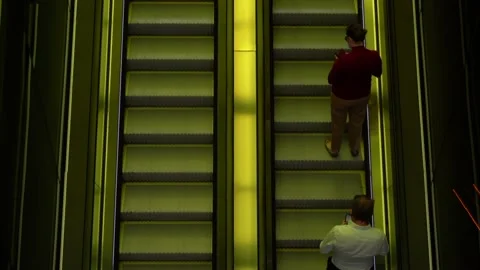 People using mobile phones going up the escalator Stock Footage 144057960