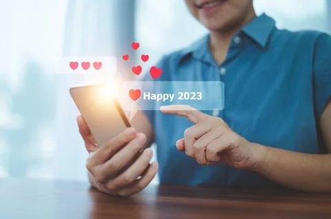 People using mobile smartphone sent message happy 2023 for happy new year c.. Stock Photos