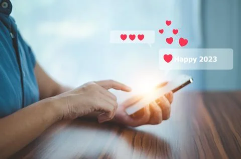 People using mobile smartphone sent message happy 2023 for happy new year c.. Stock Photos