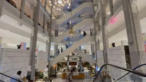 People using sets of escalators while  shopping in the luxury department store Video stock 158989431