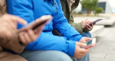 People using smart phone together Stock Footage 87950706