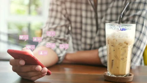 People using smartphone in cafe with pop up of notification from friend. Video stock 132812110