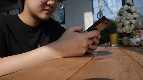 People using smartphone at coffee shop Stock Footage 105582477