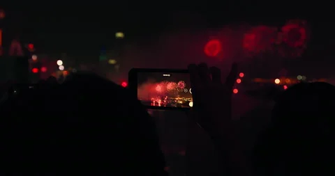 People using smartphones to capture video Hong kong national day fireworks 2018. Видео 201096297