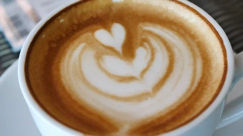 People using spoon swing mixing latte tasty in hot coffee drink Stock Footage 89273031