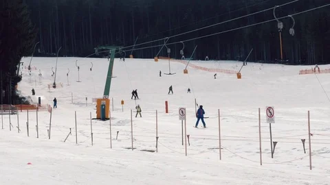 People using t-bar lift at ski resort Video stock 73637028