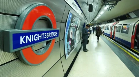 People using the under ground tube at Knightsbridge tube station Stock Footage 65007052