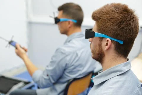 People using virtual reality glasses indoors Stock Photos