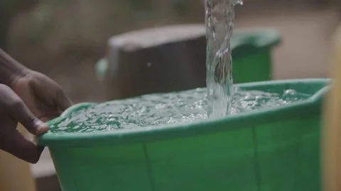 People using the water pump East Africa Malawi Stock Footage 74391004