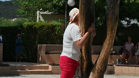 People venerating the statue of the Risen Christ in Medjugorje. Stock Footage 283594919