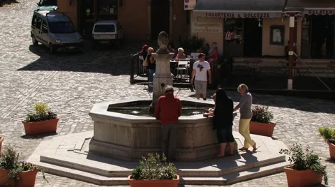 People visit central square of the medieval town of Pennabilli, Italy. Stock Footage 60105959