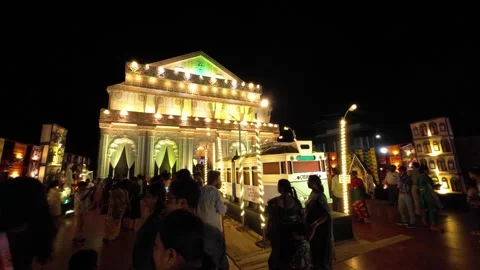 People Visiting Decorated Durga Puja Pandal with Bright Lights Stock Footage 318520487