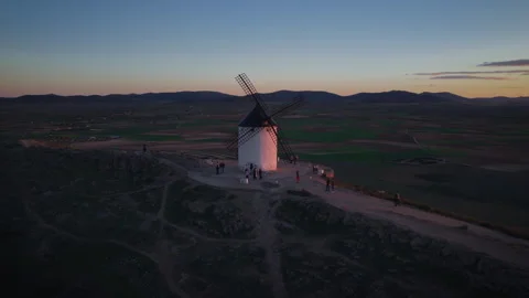 People visiting the iconic white windmill of Consuegra in Spain Stock Footage 332497828