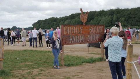 People visiting the popular Diddly Squat Farm Shop Stock Footage 159090789