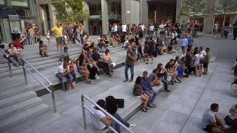 People Visiting the Square in front of the Apple Store in Milan, Italy on 9 Stock Footage 94824487