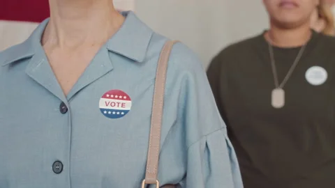 People with Vote Stickers in Queue on Elections Day Video stock 203454611
