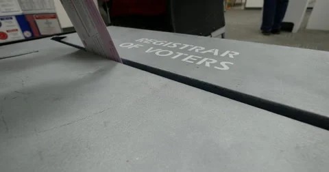 People voting in the Mid term election of 2014, a Ballot dropped into the box. Video stock 43426112