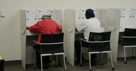 People voting in the Mid term election of 2014 Stock Footage 43426706