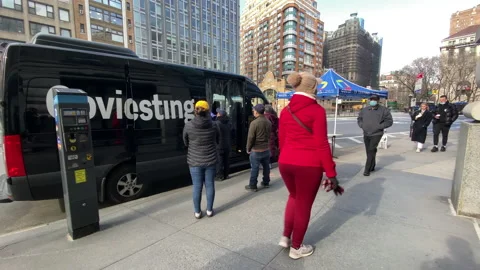 People wait in cold outside mobile COVID-19 Testing Center in New York City. Stock Footage 147453471