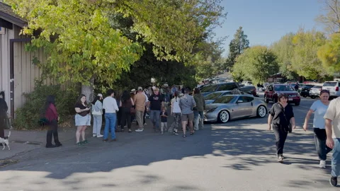 People wait in a long line to buy some Julian Pie Stock Footage 320397730