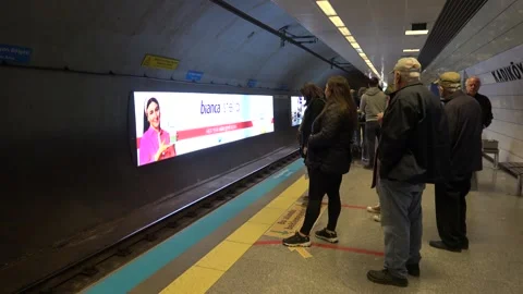 People wait for metro train on the underground station Stock Footage 304359453