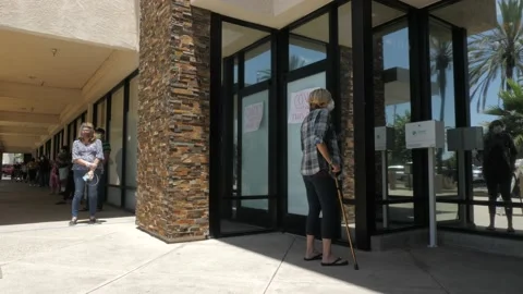 People Wait Outside COVID Test Center Stock Footage 130397320