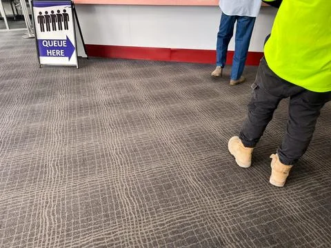 People wait in a queue Foto stock