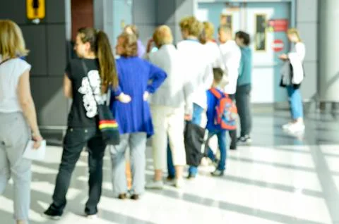 People wait in a queue to register 스톡 사진