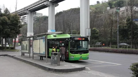 People waiting and getting on the bus at the bus stop Stock Footage 47769655