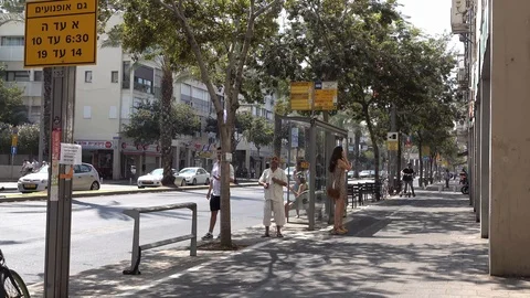 People waiting at the bus stop Video stock 118224285