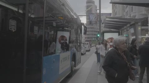 People waiting at a bus stop in Madrid, Spain Stock-Footage 345029705