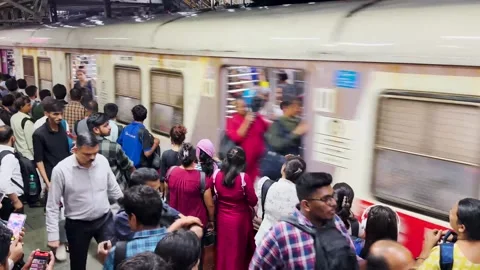 People Waiting for Local train rush at CSMT station. 4K (Night View). Stock Footage 248056767